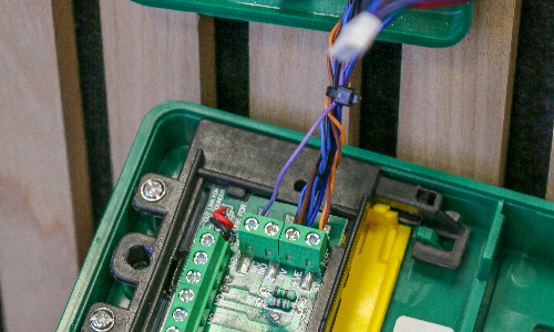 The wiring inside an emergency break glass unit