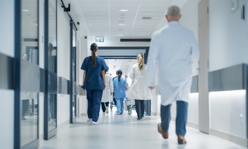 Staff walking through the hospital corridor