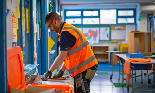 Facilities man maintaining school building