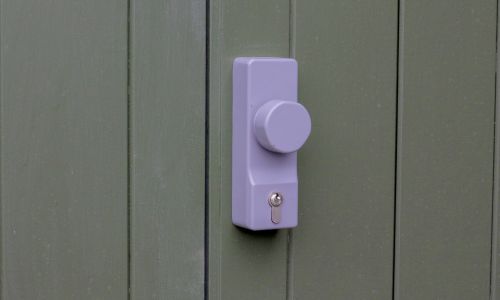 OAD with knob operation on green painted external door.