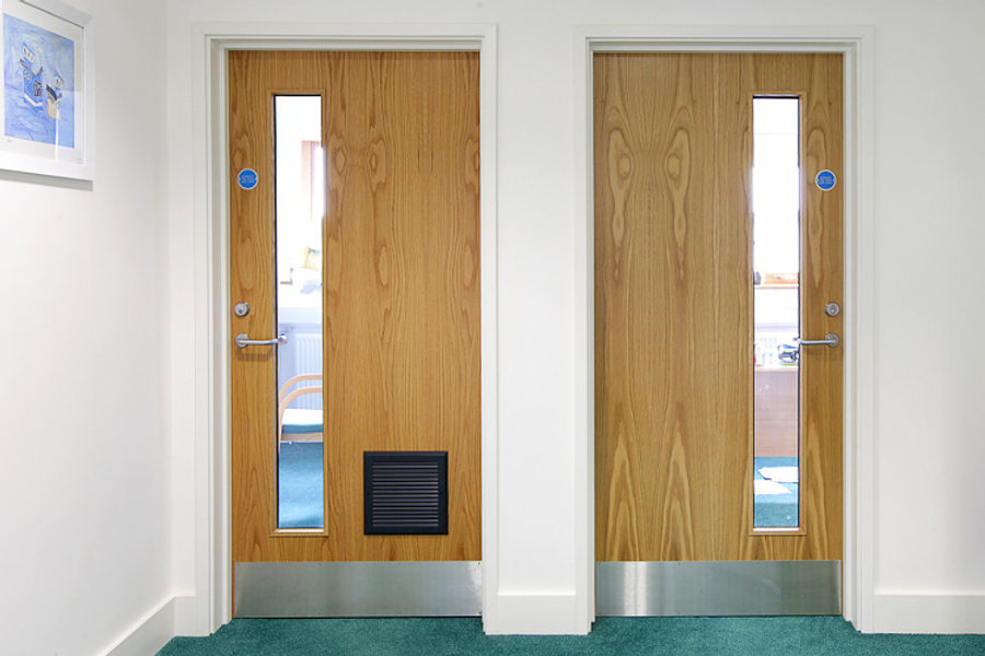 Two single fire doors with lever door handles