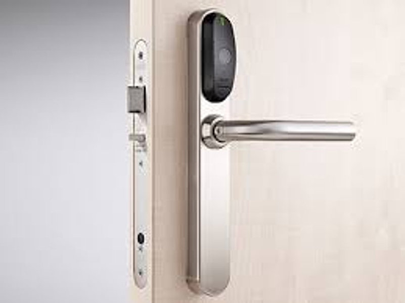 Silver access control door handle on door