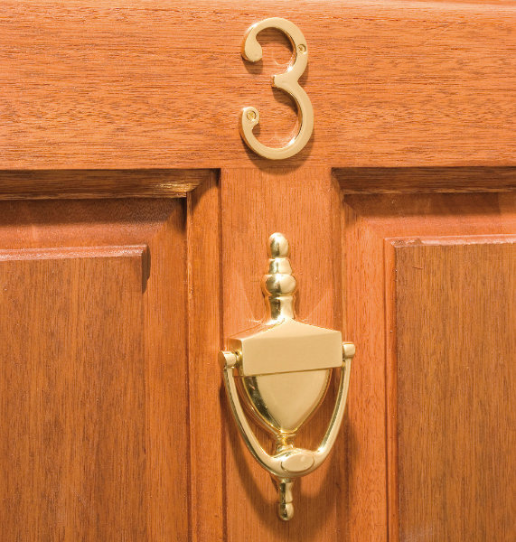 Brass urn knocker and numeral three